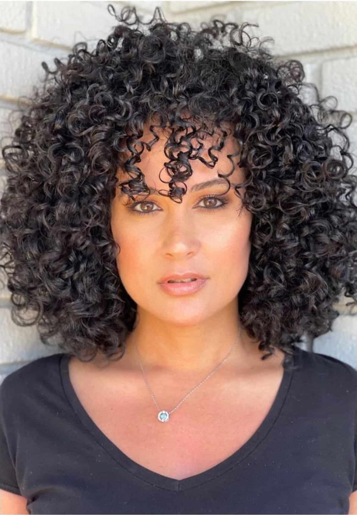 Short Curly Hair with Bangs: 21 Stylish Looks for 2024
