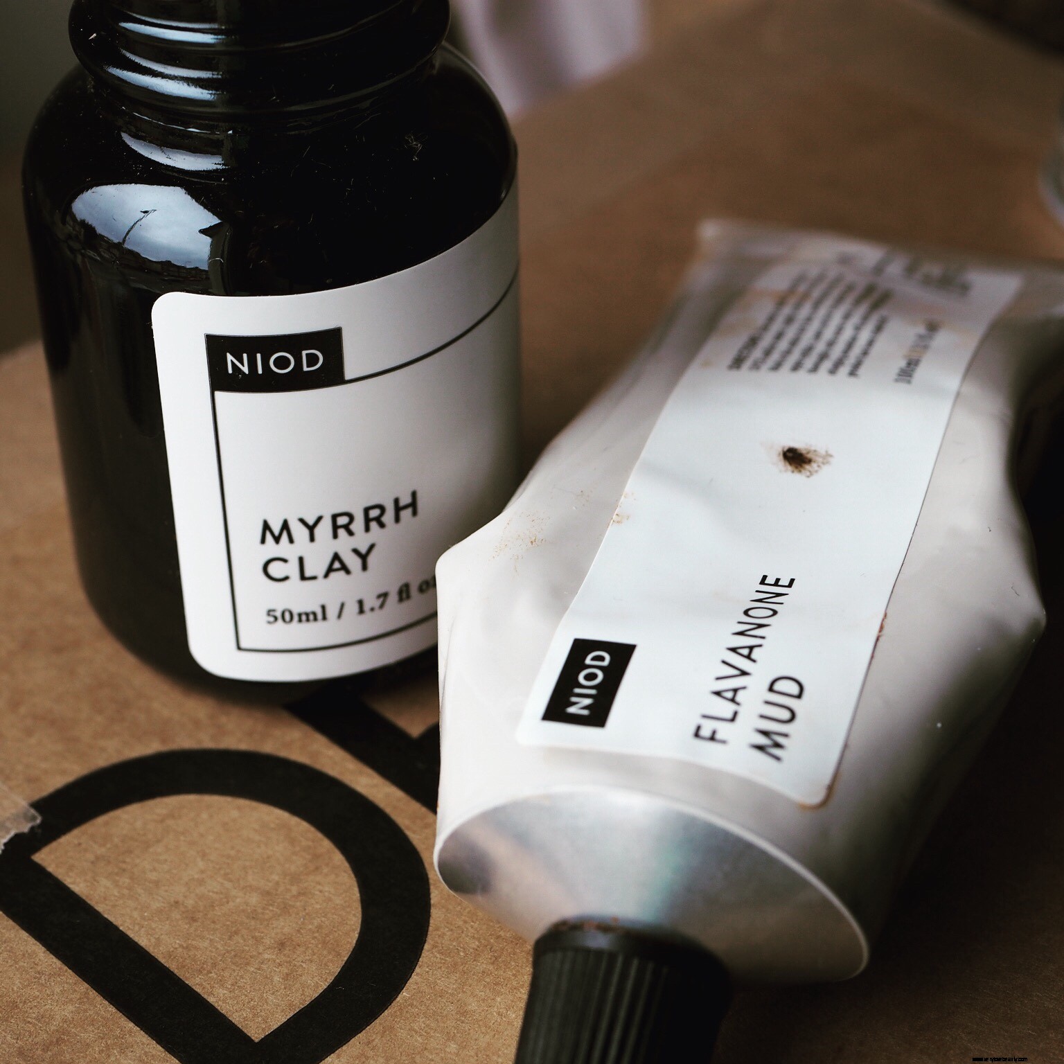 NIOD Mask Comparison: Flavanone Mud vs. Myrrh Clay - Which is Best for You?