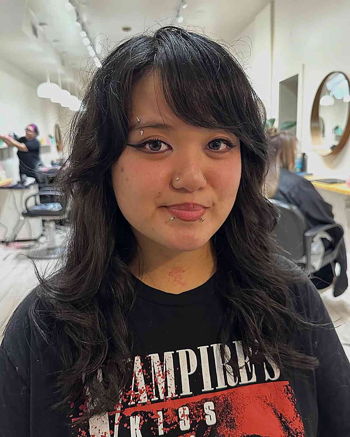 Medium Layered Haircuts with Side-Swept Bangs: Style & Versatility