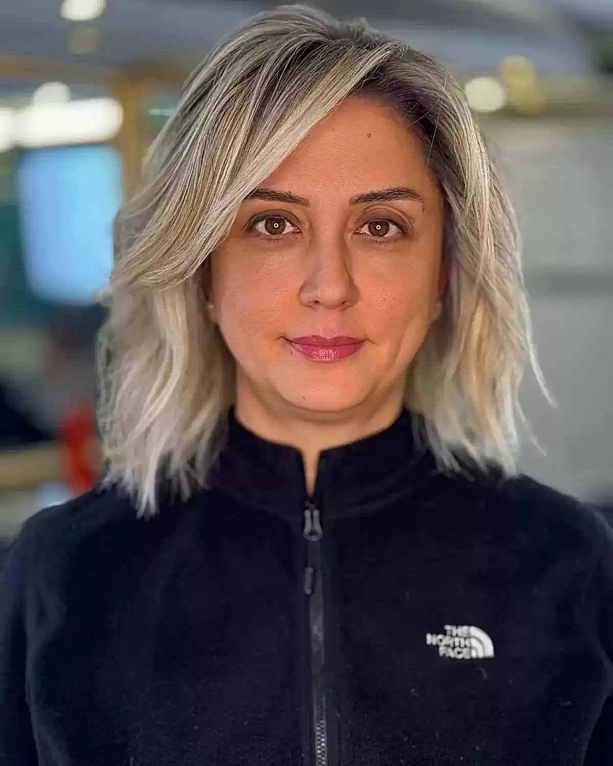 Medium Layered Haircuts with Side-Swept Bangs: Style & Versatility