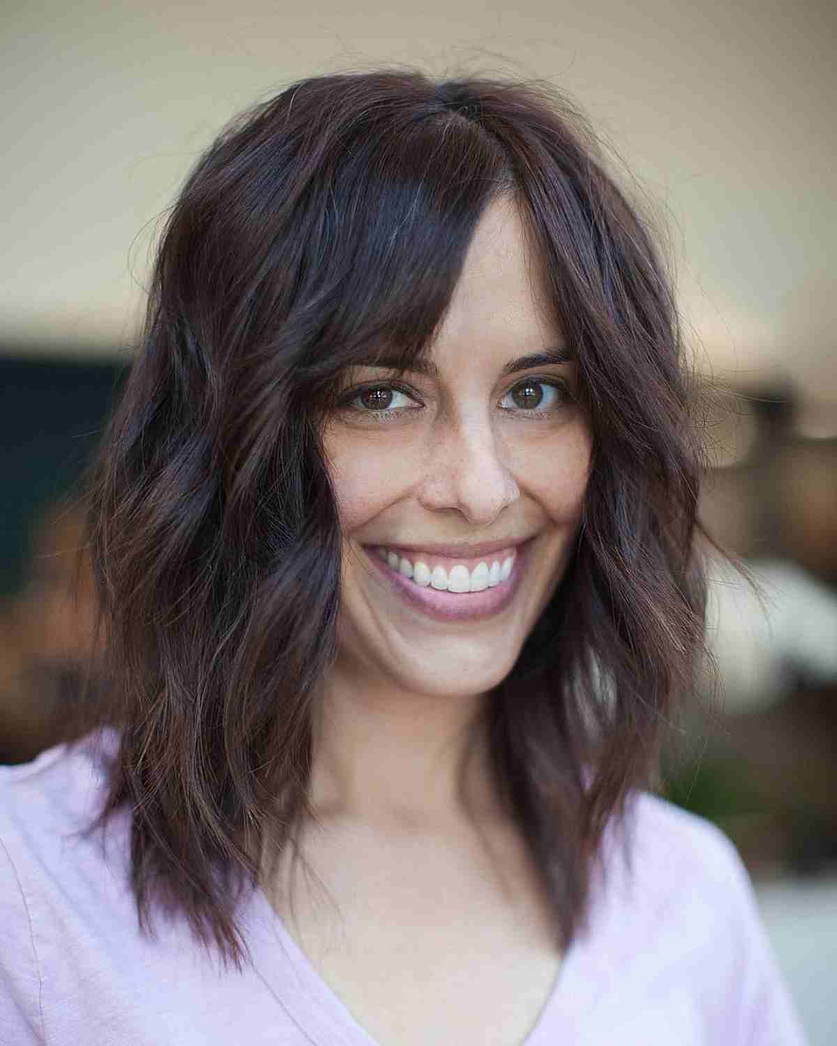 Medium Layered Haircuts with Side-Swept Bangs: Style & Versatility