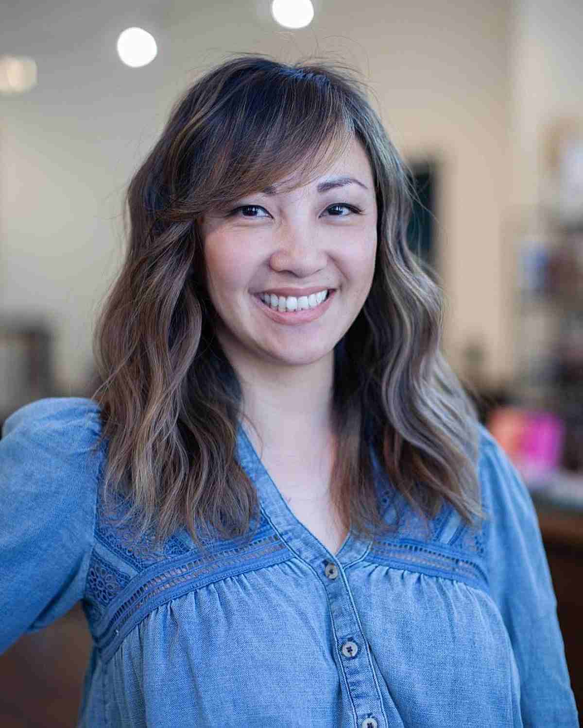 Medium Layered Haircuts with Side-Swept Bangs: Style & Versatility