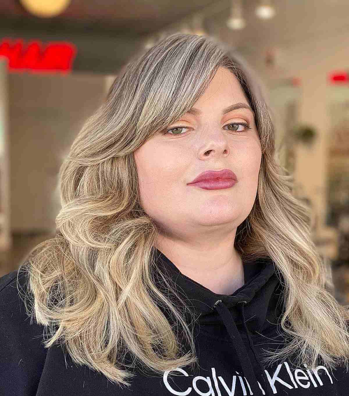 Medium Layered Haircuts with Side-Swept Bangs: Style & Versatility