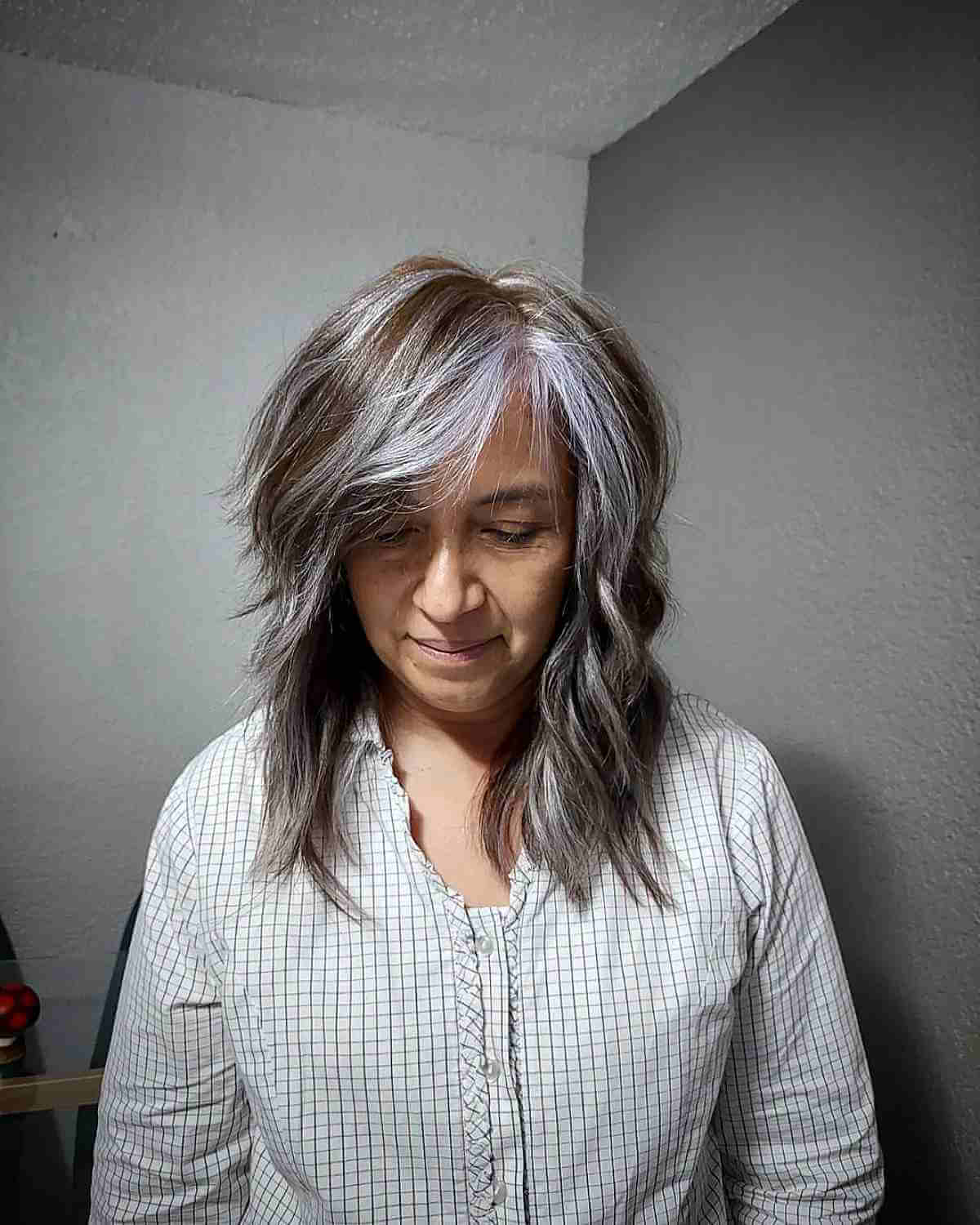 Medium Layered Haircuts with Side-Swept Bangs: Style & Versatility