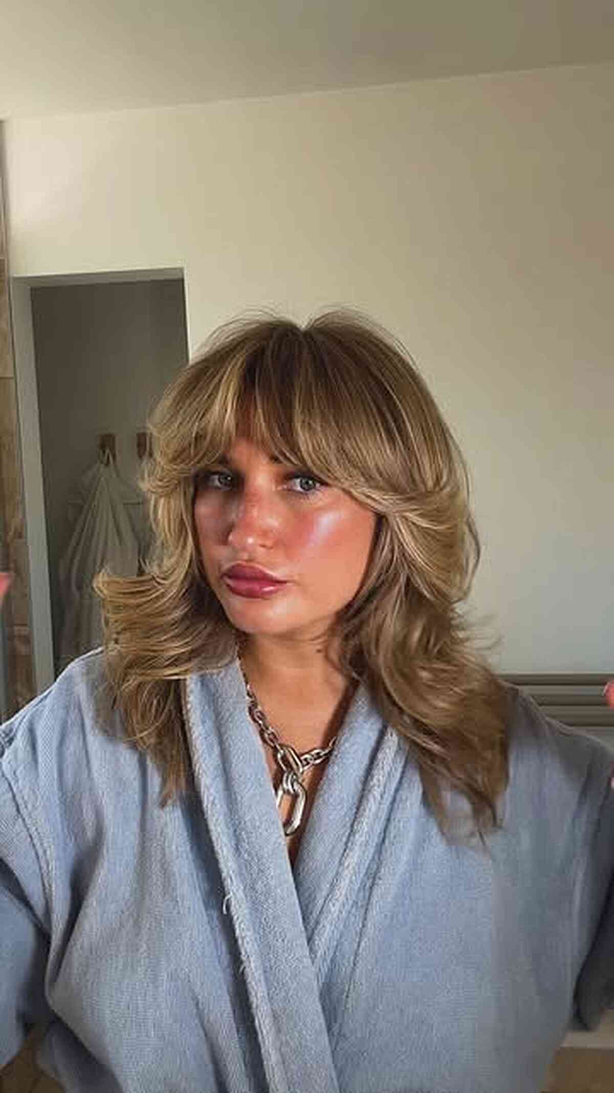 Shoulder-Length Hair with Curtain Bangs: Styles & Styling Tips