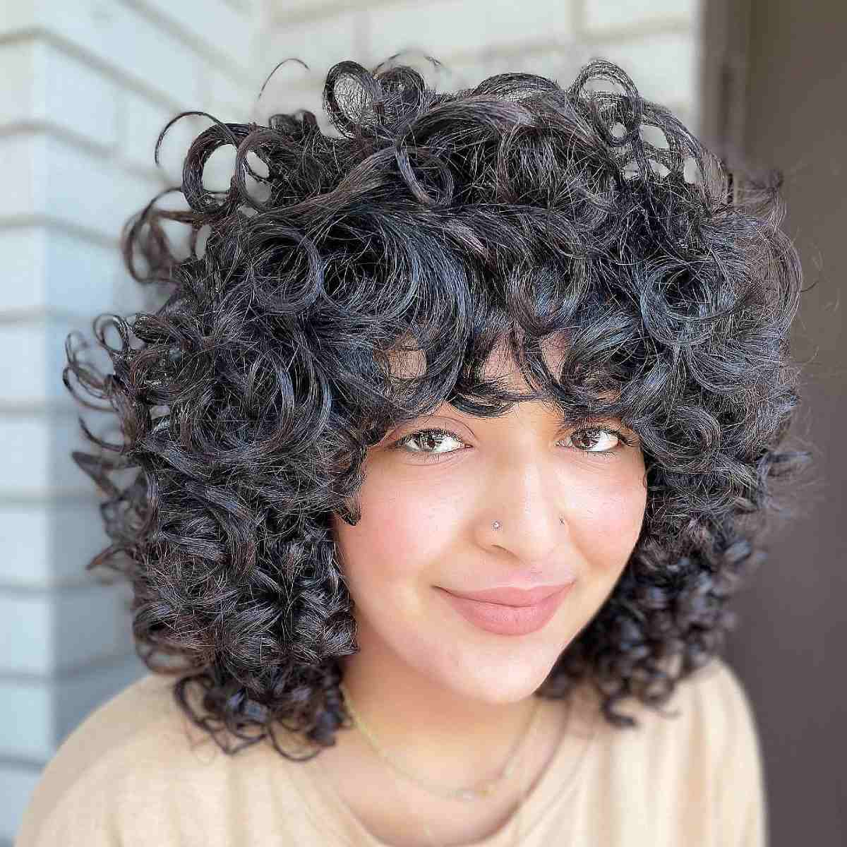 Curly Bob with Bangs: Styles & How to Choose the Best Cut for You
