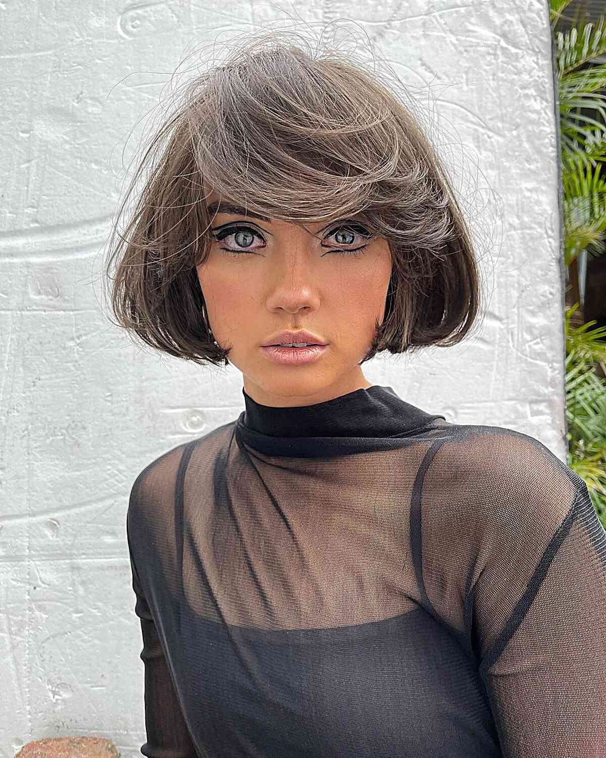 Cortes de pelo Bob hasta la mandíbula:estilos y consejos de peinado para un corte elegante
