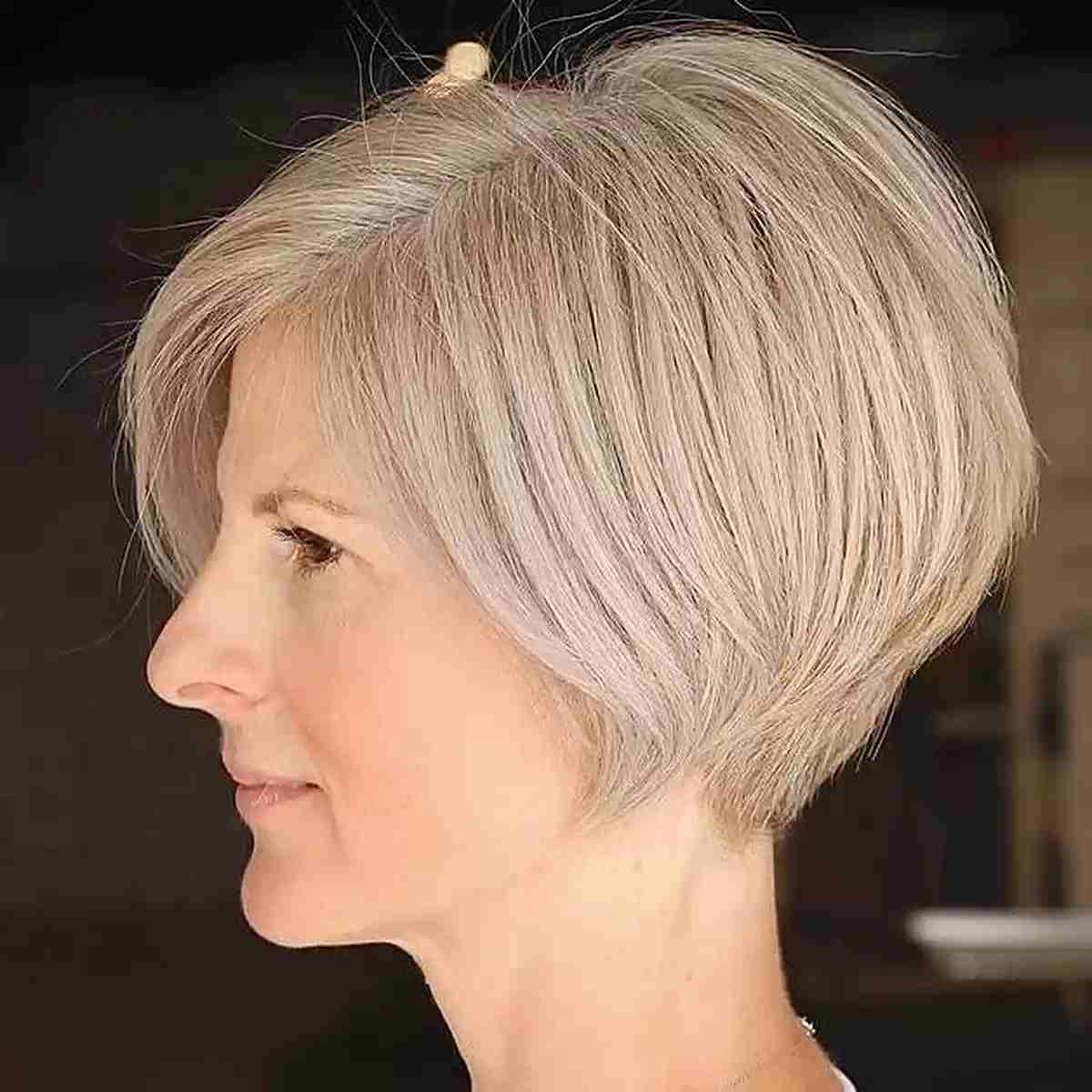 Cortes de pelo Bob hasta la mandíbula:estilos y consejos de peinado para un corte elegante
