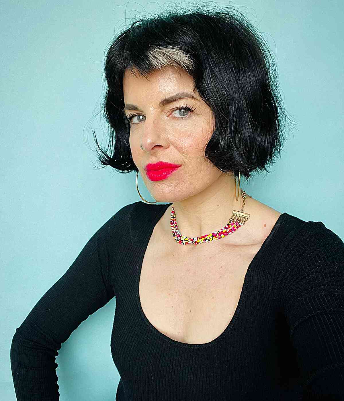 Cortes de pelo Bob hasta la mandíbula:estilos y consejos de peinado para un corte elegante