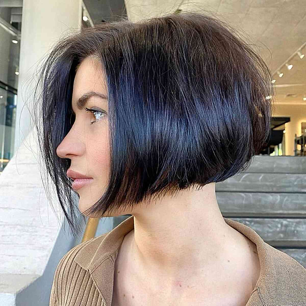 Cortes de pelo Bob hasta la mandíbula:estilos y consejos de peinado para un corte elegante