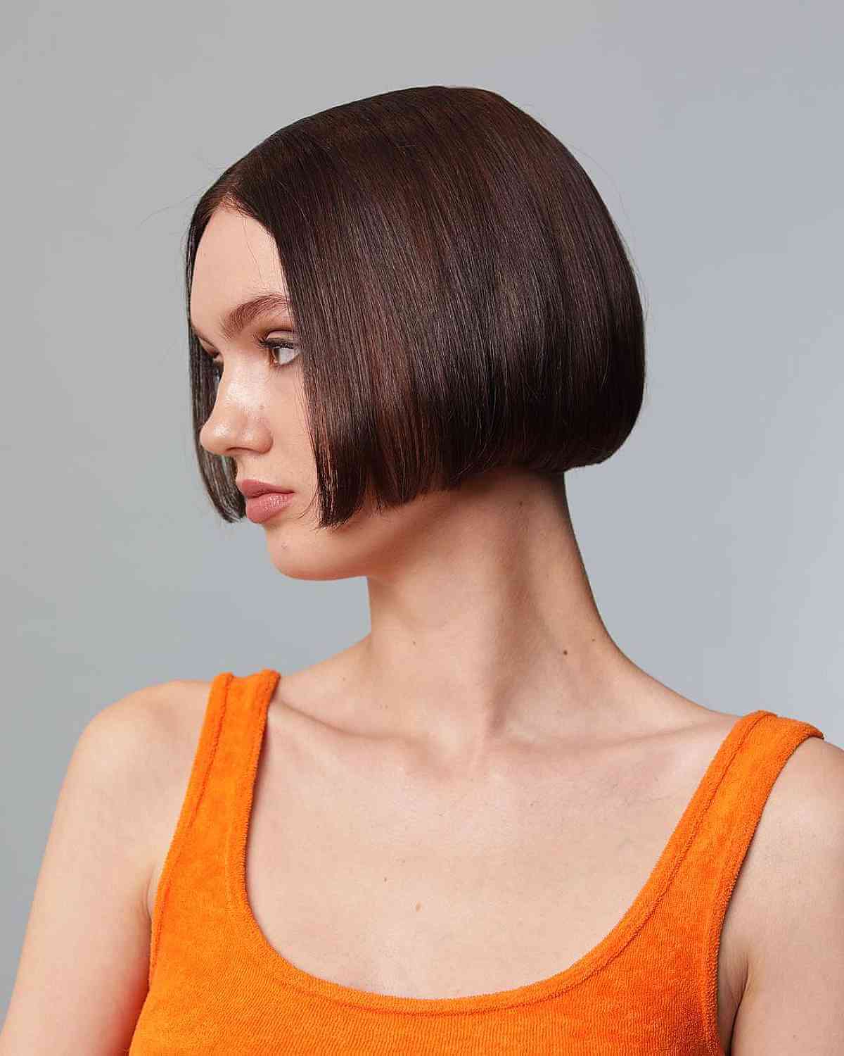 Cortes de pelo Bob hasta la mandíbula:estilos y consejos de peinado para un corte elegante