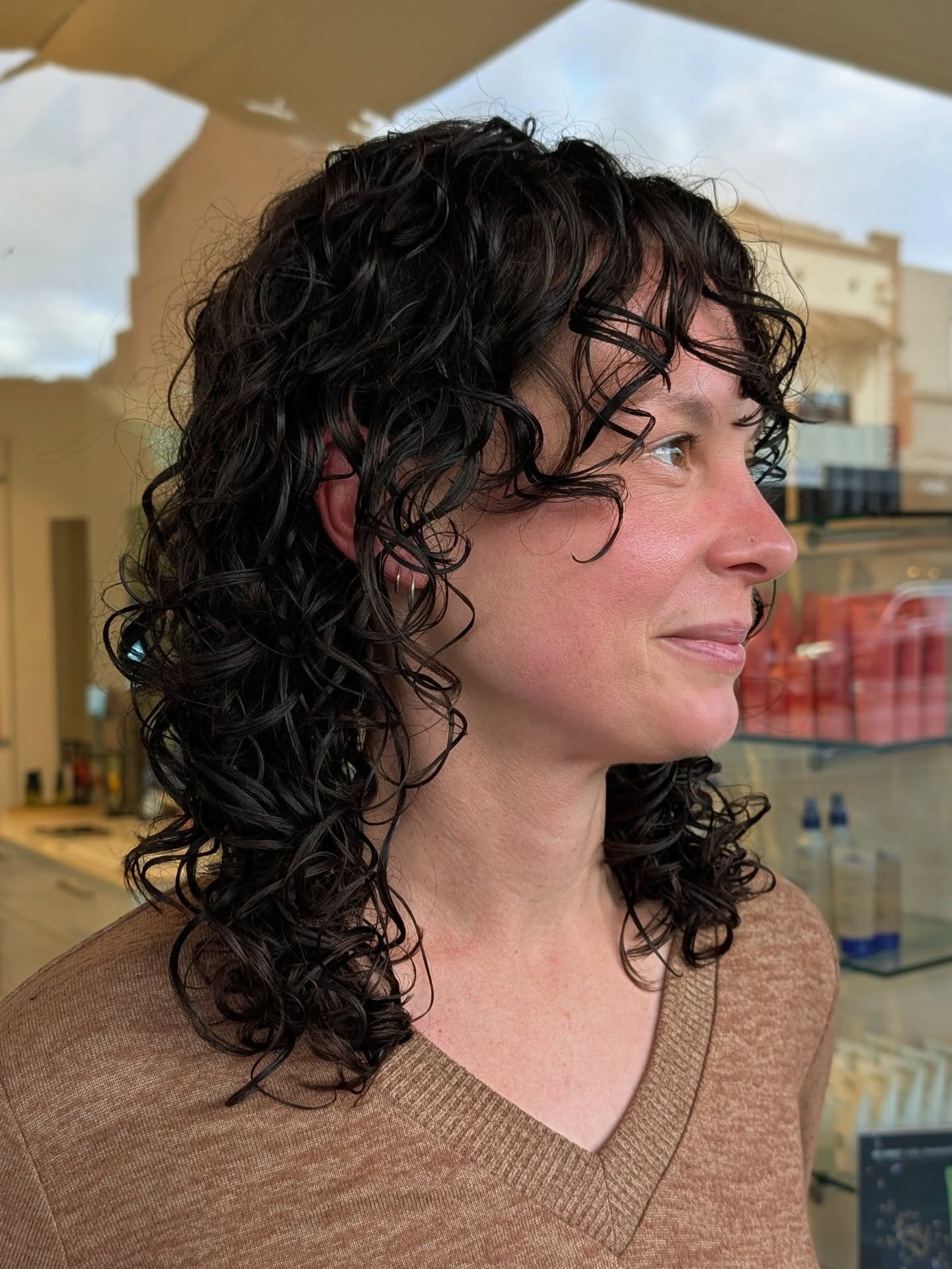 Curly Shag-kapsels voor gemiddelde lengte:trends en stylingtips voor 2026