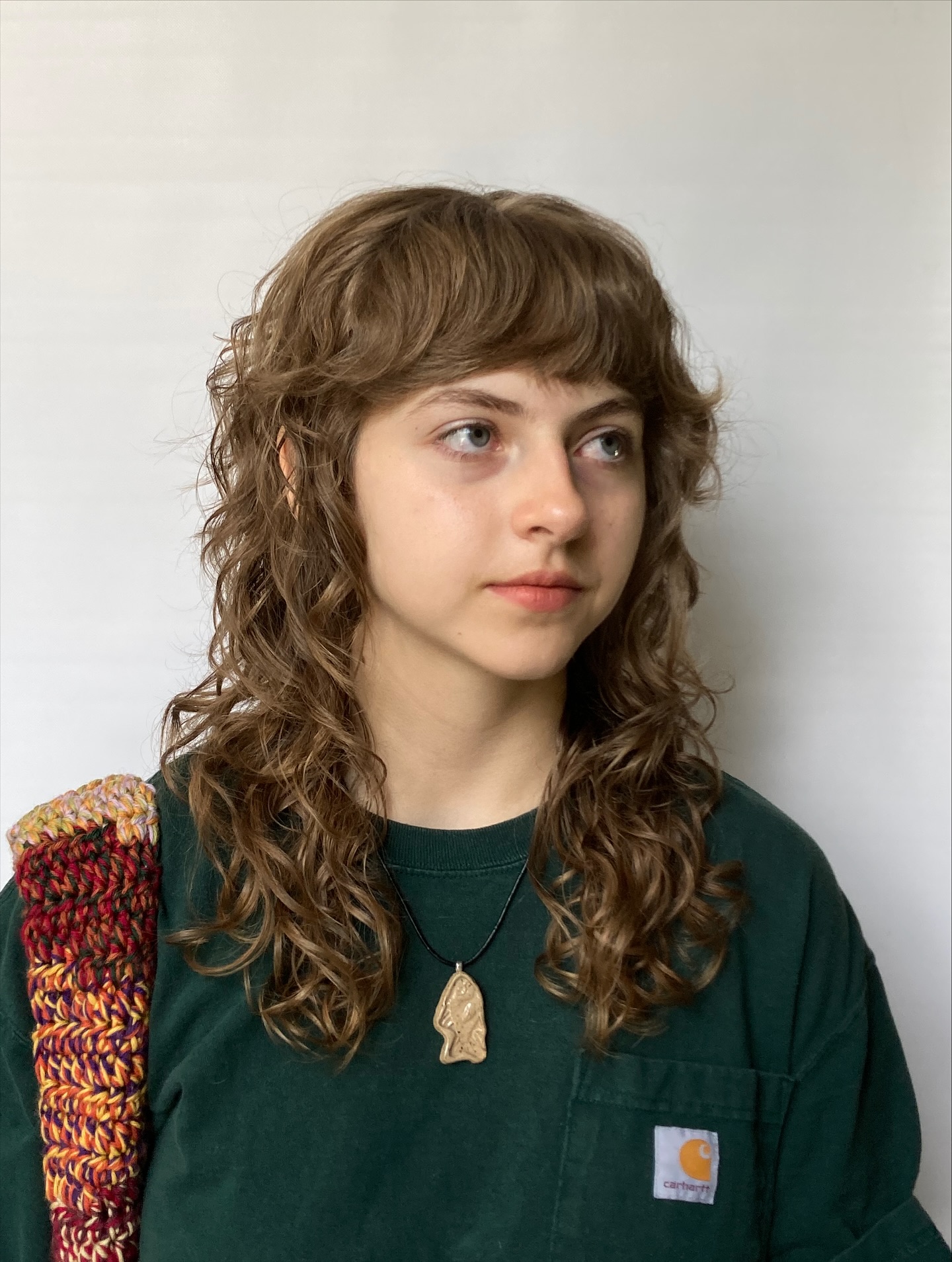 Coupes de cheveux bouclés Shag avec frange :tendances et conseils de style pour 2026 