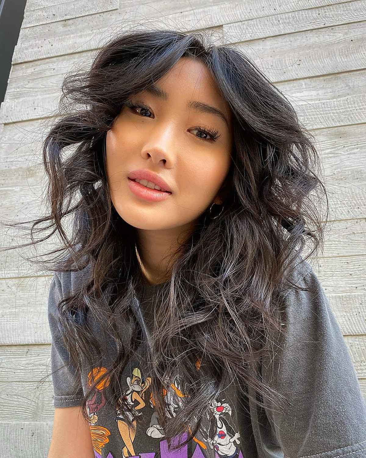 Franges de rideaux et cheveux ondulés :29 idées de coiffure et conseils d experts